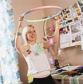 Woman hanging up children's mobile