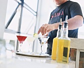 A man mixing Martini cocktails