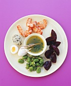 Plate of appetisers: prawns, vegetables, quails' eggs & dip