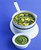 Vegetable soup with noodles and basil pesto