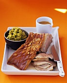 Pork with crackling and mushy peas