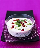 Labneh yoghurt dip with chilli, pomegranate seeds, mint and dill
