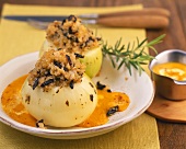 Onions with bulgur and prune stuffing on pumpkin sauce