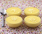 Four small bowls of white chocolate mousse