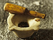 Mortar with wooden pestle