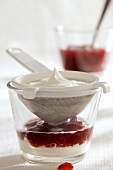 Strawberry compote with yoghurt cream & whipped cream in glass
