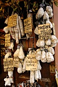 Various types of salami in a shop in Norcia (Italy)