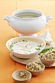 Cauliflower soup with nut crumbs and chives