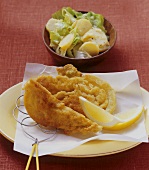 Breaded savoy cabbage wedges with potato salad