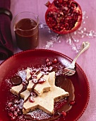 Gingerbread parfait with chocolate sauce & pomegranate seeds