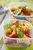 Pasta salad with grilled vegetables in food storage boxes