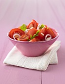 A small bowl of tomato salad