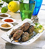 Three Moroccan spiced kofta kebabs with lemon