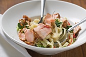 Ribbon pasta with fried peppered salmon and red pepper