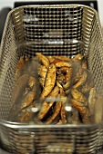 Sardines in a deep-frying basket