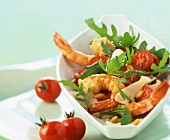Rocket salad with garlic prawns, tomatoes and pine nuts