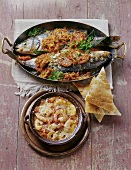 Braised sea bass, prawns with vegetables