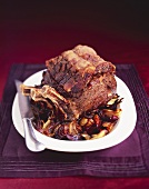 Roast rib of beef with port wine sauce and balsamic onions