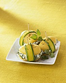 Courgette-wrapped potatoes stuffed with herb soft cheese