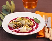 Stuffed cabbage leaves with beetroot and horseradish sauce