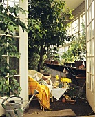 Chair and small table in a conservatory