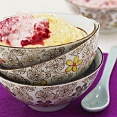 Polenta and nut pudding with raspberry cream