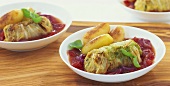 Stuffed Chinese cabbage leaves with potatoes & tomato sauce