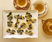 Small appetisers with radishes to serve with tea