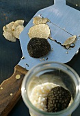 Italian truffles in jar and on truffle slicer