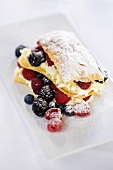 Puff pastries with berries and icing sugar