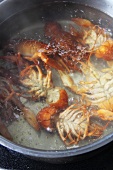 Crayfish being cooked in boiling water