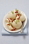 Steamed yeast dumplings with fried diced bacon