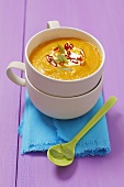 Cream of carrot soup with chillis and mint