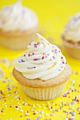 Cupcakes decorated with colourful sprinkles