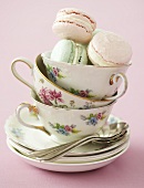 Tea cups with coloured macaroons