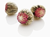 Three jasmine tea balls