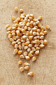 Corn kernels on a chopping board