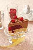 A piece of Christmas chocolate mousse tart with raspberries