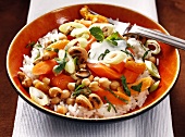 Rice salad with chickpeas, peach, cashew nuts and yogurt