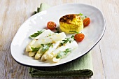 White asparagus with rocket and an egg pastry