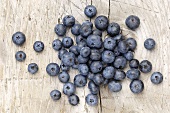 Blueberries on a wooden surface, seen from above