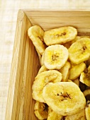 Banana chips in a wooden crate
