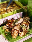 Grilled chicken breast wrapped in bacon with rosemary