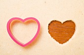 Biscuit dough with a heart-shaped cutter