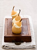 Poached pears filled with Camembert ice cream