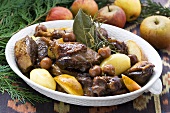 Duck stew with cherries, apples and potatoes