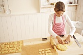 Girl rolling out pastry