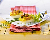 Eggs filled with capers, bacon and chives