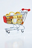 A shopping trolley filled with chocolate euro coins