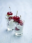 Cream and cherry dessert in glasses